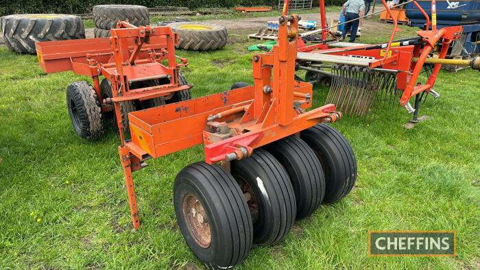 Ritchie front mounted swath press with string carrier