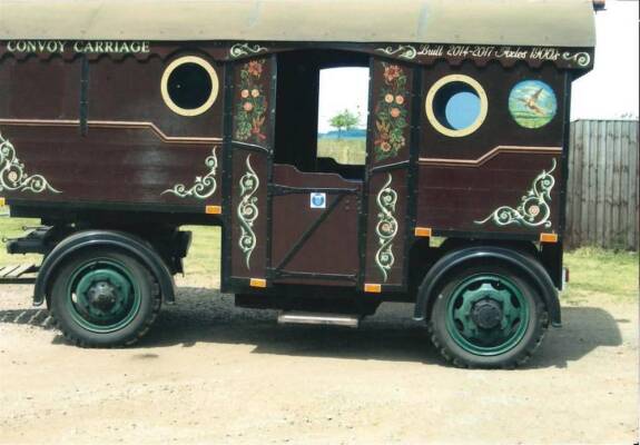 Custom built roadmans utility carriage which has been constructed as a support trailer to accompany a steam roller. This well equipped trailer is a new construction built on a set of vintage axles and turntable. The vendor reports that it is fitted with n