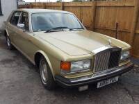 1984 ROLLS ROYCE Silver Spirit Reg. No. A851 YGL Serial No. SCZ50009ECH08412 Fitted with the 6,750cc twin carb V8 petrol engine the Silver Spirit is presented in a fetching gold with tan leather interior. The vendor reports there is good service history o