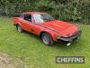 1977 TRIUMPH TR7 1998cc petrol CAR Reg. No. RJE 686S Chassis No. ACG18719 Miles: 18,833 MOT: Exempt (Last expired 22nd July 2012) Finished in Flamenco red with TR7 decals and red tartan seat upholstry. This TR7 coupe appears to have been owned by the vend - 2