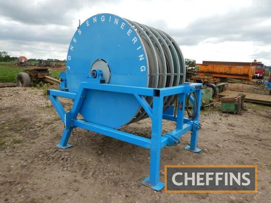 2017 Jones lay flat recoiler mounted 5 section layflat hose reel, fitted with c.926m Bauer 5inch layflat pipe male and female connectors Serial No. JEHR058