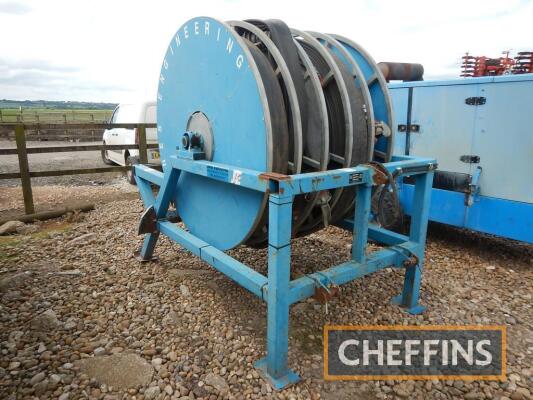 2010 Jones 1000M/5inch mounted 5section lay flat hose reel fitted with c.897m layflat hose with Bauer Male and female connectors. Serial No. JELHR030