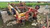 Jones mounted windrower with side elevator spares