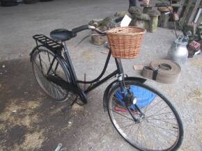 Vintage bicycle with wicker shopping basket