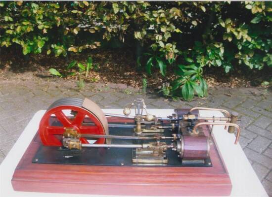 Horizontal twin cylinder mill engine model displayed on mahogany plinth, believed to be modelled on Astley Mill, Dukinfield, for cotton spinning