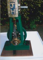 Vertical steam engine model, modelled on a high speed generating engine displayed on a hard wood plinth, standing 15ins high