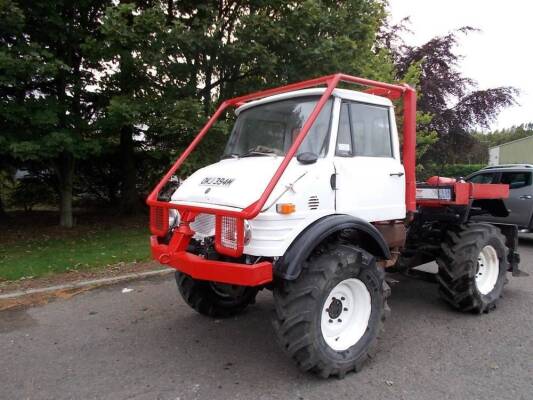 Circa 1973 Daimler Benz Unimog 406 Reg. No. OKJ 394M (expired) This example of the Unimog is stated to be fitted with a rear winch and land anchor, finished in white with red protection cage, offered for sale without documentation