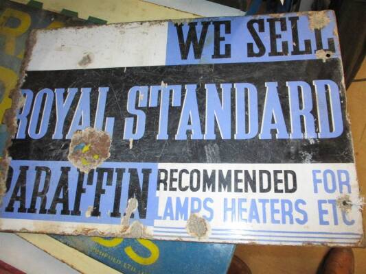 'We Sell Royal Standard Paraffin Recommended for Lamps and Heaters' enamel sign