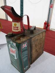Esso oil jug and two oil cans