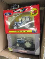 ERTL 1:64 scale Ford 8240 4wd tractor model, boxed t/w Britains 1:32 scale Ford 7000 tractor model, boxed and Universal Hobbies 1:32 scale Ford 5000 tractor model, boxed