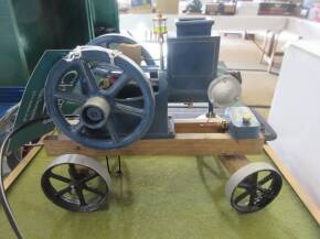 Solar powered open crank stationary engine model on trolley