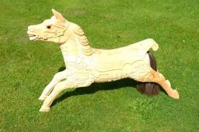 A wooden juvenile size galloping Horse, very highly carved in the style of Anderson's of Bristol. Fitted with glass eyes and genuine horse hair tail.