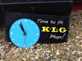 'Time to fit KLG Plugs', a printed tin showroom clock