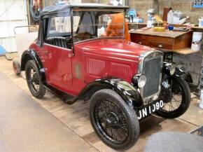 1931 747cc Austin 7 AG Tourer Reg. No. JN 1090 Chassis No. 133080 Engine No. M132054 Finished naturally in ruby red over black this handsome little Austin was restored by a previous owner. The last owner having now passed on leaves the Austin seeking a n