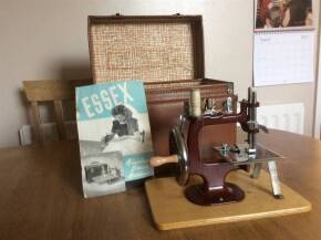 Miniature sewing machine (Essex) in original leather case with original receipt and instructions