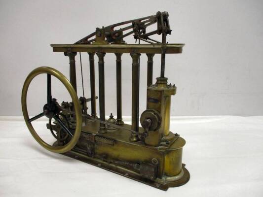 An important model 6 column beam engine with reversing gear built by D Erskine, Edinburgh for the 1851 Great Exhibition. The valve chest is profusely engraved with Prince of Wales feathers and Scottish Thistles as well as other floral motifs and marked fo