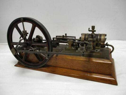 A well constructed antique model of a Tangye horizontal engine which is understood to have been built c1870 by A Woffenden. Fitted with a most uncommon flywheel centrifugal governor, plank lagged cylinder and two double crosshead guidebars. The whole asse