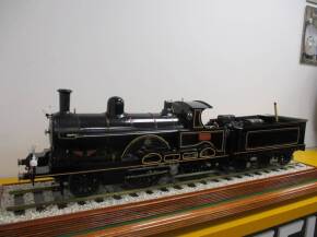 3.5ins Gauge LNWR Teutonic class 2-4-0 No.1304 'Jeanie Deans' locomotive and tender (built 1890). This fine model has been built with three cylinders as per the original, the 2 outside drove the rear axle whilst the inside low pressure drove the front as 