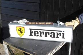 Ferrari, a recreated hanging illuminated sign, ex Goodwood Revival Ronnie Hoare Maranello Concessionaires dealership, 37x9x6ins t/w Colonel Ronnie Hoare desk name stand (screen printed)