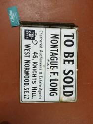 Montague F Long To Be Sold, a double sided enamel estate agent sign, 20x15ins