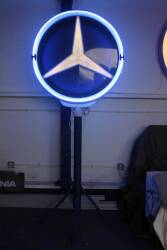 Mercedes-Benz, 1960s forecourt double sided illuminated sign with blue neon rim lighting. Steel construction on a custom built stand 3ft3ins dia', 8ins deep, 7ft11ins tall overall, ex garage in the south of France