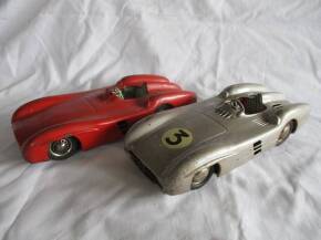 Mercedes-Benz tinplate W196 style cars (2), one battery operated the other push along, both lacking screens, marked Made In Western Germany
