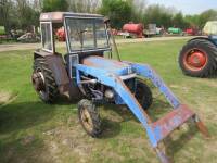 LEYLAND 154 diesel TRACTOR Fitted with a front loader, cab, rear wheel weights and rear linkage. Supplied by T. Parker & Sons, Surrey.