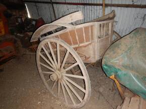 Horse drawn governess cart in as discovered barn find condition, appearing complete and sound