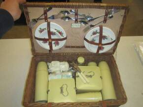 Coracle picnic basket containing crockery, cutlery, flasks and sandwich boxes