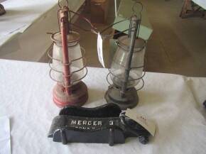 Cast iron cartwheel chock marked mercer 3 Milton and Burbage t/w 2no. hurricane lamps