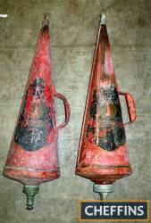 A pair of wall mounted conical fire extinguishers