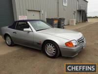 1990 2960cc Mercedes-Benz 300SL convertible Reg. No. H146 WAH Chassis No. WDB129060F21177 Engine No. 10398422001900 Fitted with a straight 6 petrol engine and 4speed automatic transmission, this SL is finished in silver with blue leather interior, both of
