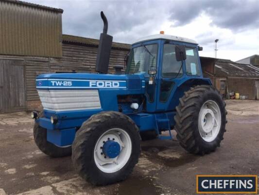 1984 FORD TW-25 6cylinder diesel TRACTOR Reg. No. B516 LRT Serial No. 912217 Fitted with a Q cab, rear inner and out wheel weights, rear PAVT wheels, rear linkage and drawbar on 18.4R38 rear and 14.9R28 front wheels and tyres