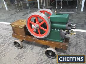 'Economy' model open crank hit and miss petrol stationary engine, in working order, 19ins x 12ins, 10 1/2ins in diameter fly wheels and trolley mounted