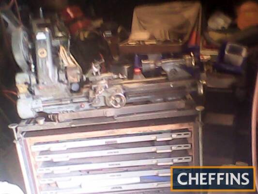 Myford model makers lathe fitted to a levelling table with shelving and complete with extra chucks, tools and associated fittings