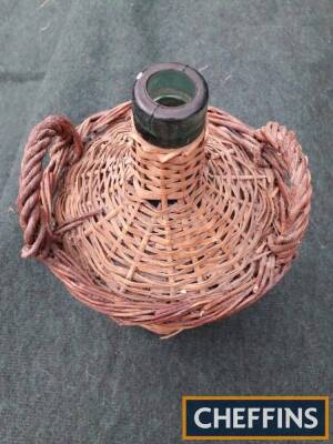 Bottle in a basket, together with a small bowl and a brass kettle stand