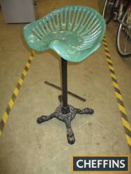 Cast iron seat and a 4 footed cast base, bar stool style