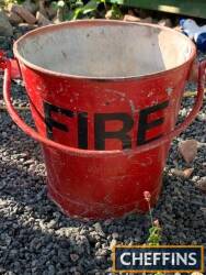 Fire, a riveted bucket in red