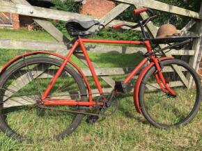 1940s Post Office bicycle with parcel tray and WW2 helmet