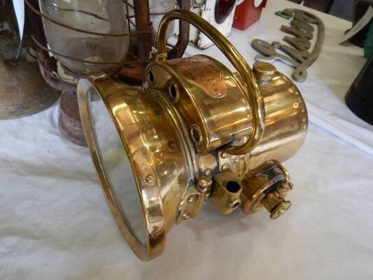 H&B headlight no. 1130, a fork mounted self generating brass headlamp, bezzle diameter 7.5ins