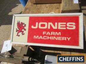 An illuminated Jones Farm Machinery display sign
